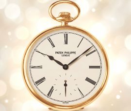Elegant Patek Philippe gold pocket watch with classic Roman numeral dial and vintage styling