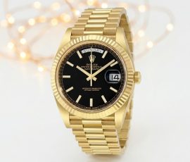 Luxury gold Rolex Day-Date watch with black dial displayed for sale at Schiller Park Jewelry Coins & Collectibles